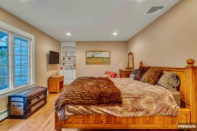 717 Ashmont Rd, Franklin Lakes, NJ 07417 - bedroom featuring light wood-style flooring, a baseboard radiator, and recessed lighting