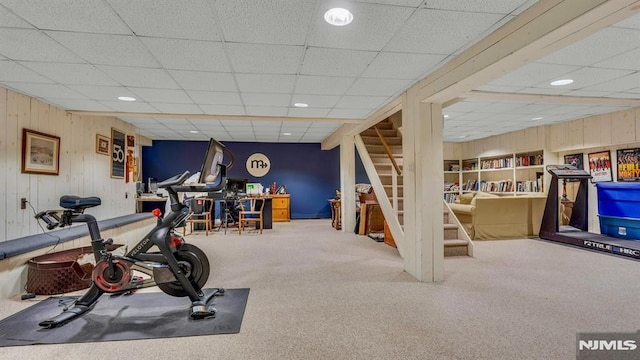717 Ashmont Rd, Franklin Lakes, NJ 07417 - exercise area featuring a paneled ceiling, carpet, wood walls, and recessed lighting