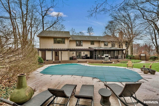 717 Ashmont Rd, Franklin Lakes, NJ 07417 - rear view of house with a deck, a pergola, and a patio area