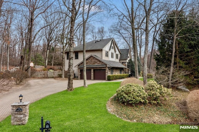 717 Ashmont Rd, Franklin Lakes, NJ 07417 - view of side of property featuring an attached garage, driveway, stone siding, and a shingled roof