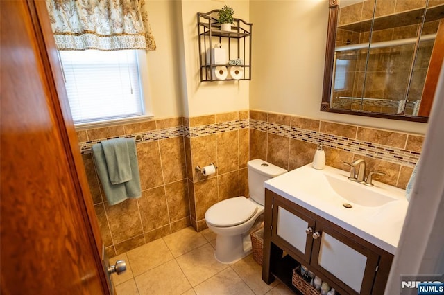 87 Pilch St, Bloomfield, NJ 07003 - bathroom featuring vanity, tile patterned floors, tile walls, and wainscoting