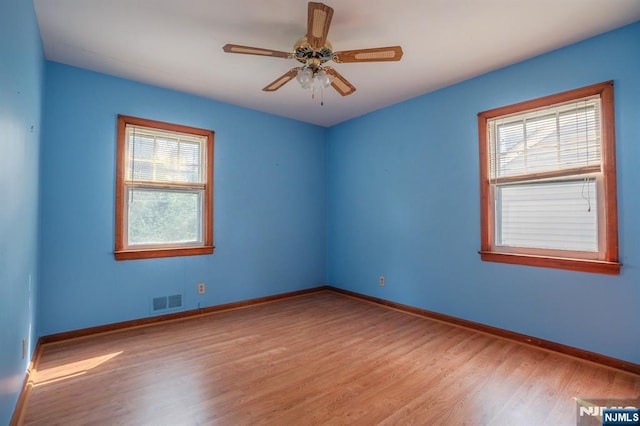 11 Newman Ave, Nutley, NJ 07110 - spare room with wood finished floors, healthy amount of natural light, baseboards, and a ceiling fan