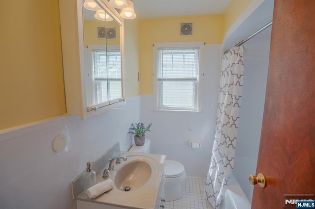 11 Newman Ave, Nutley, NJ 07110 - bathroom featuring vanity, toilet, shower / bath combo, and tile patterned floors