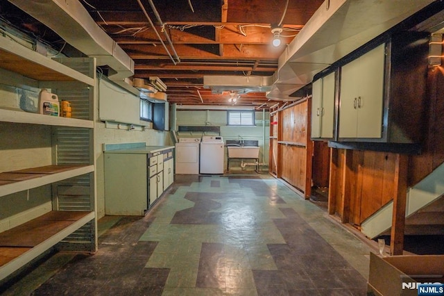 11 Newman Ave, Nutley, NJ 07110 - basement featuring washing machine and dryer, dark floors, and a sink