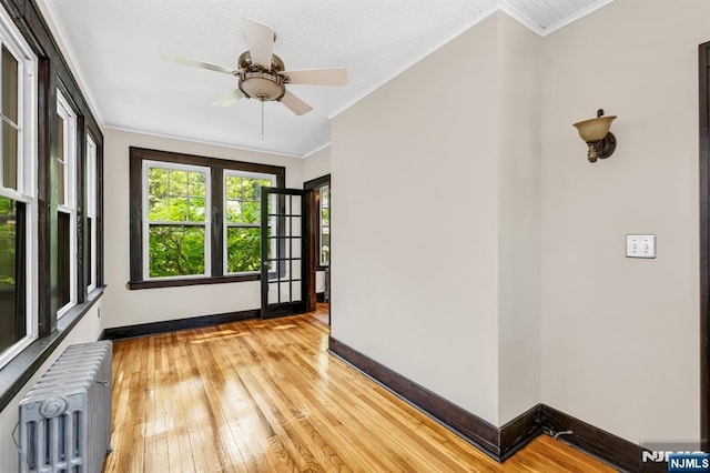 67 Woodland Rd, Bloomfield, NJ 07003 - unfurnished sunroom featuring radiator heating unit