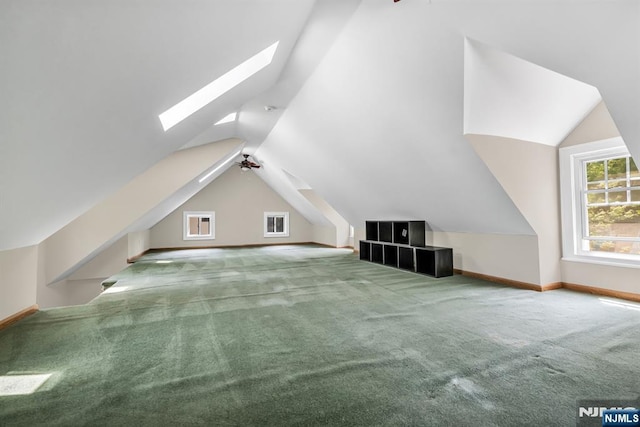 67 Woodland Rd, Bloomfield, NJ 07003 - additional living space with lofted ceiling, carpet, a skylight, and baseboards
