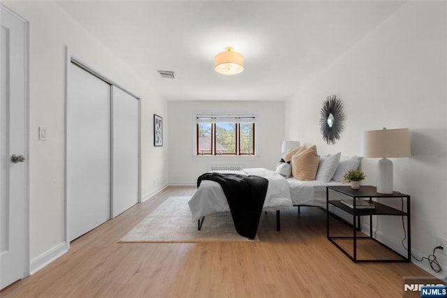530 Broad Ave Unit 2, Englewood, NJ 07631 - bedroom featuring light wood-style flooring, a closet, and baseboards
