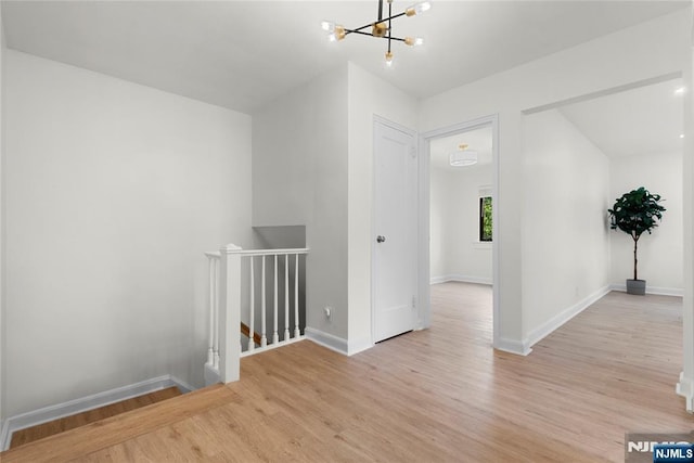 530 Broad Ave Unit 2, Englewood, NJ 07631 - bonus room featuring wood finished floors, a chandelier, and baseboards