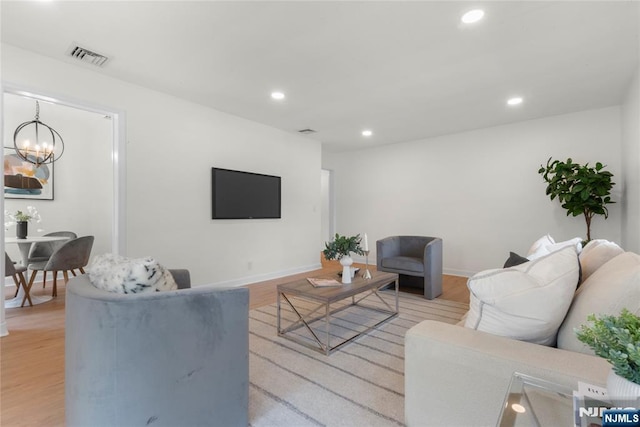 530 Broad Ave Unit 2, Englewood, NJ 07631 - living area with a chandelier, recessed lighting, wood finished floors, and baseboards