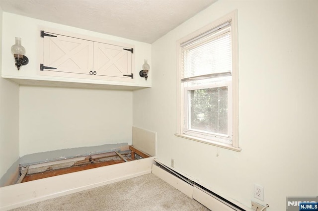 408 Terhune Ave, Paramus, NJ 07652 - laundry room featuring carpet and baseboard heating