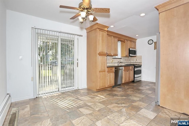 408 Terhune Ave, Paramus, NJ 07652 - kitchen with stainless steel appliances, baseboard heating, stone tile flooring, tasteful backsplash, and recessed lighting