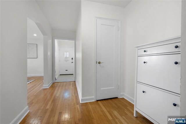 530 Broad Ave Unit 17, Englewood, NJ 07631 - hallway with light wood finished floors and baseboards