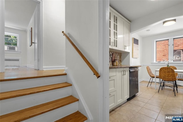 530 Broad Ave Unit 17, Englewood, NJ 07631 - staircase featuring radiator heating unit, tile patterned floors, cooling unit, and baseboards