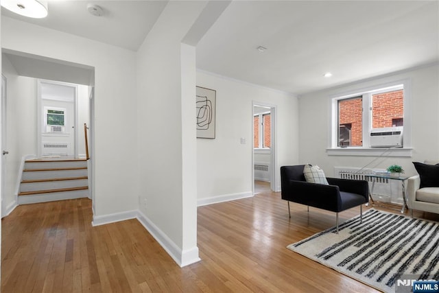 530 Broad Ave Unit 17, Englewood, NJ 07631 - sitting room with light wood-type flooring, baseboards, cooling unit, radiator heating unit, and recessed lighting