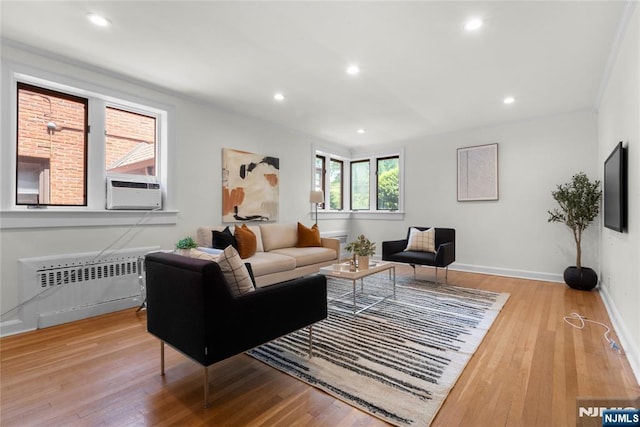 530 Broad Ave Unit 17, Englewood, NJ 07631 - living area with radiator heating unit, wood finished floors, baseboards, recessed lighting, and cooling unit