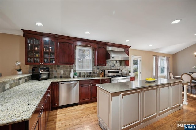 14 Old Chimney Rd, Randolph Township, NJ 07869 - kitchen featuring stainless steel appliances, wall chimney exhaust hood, light wood-style floors, tasteful backsplash, and a sink