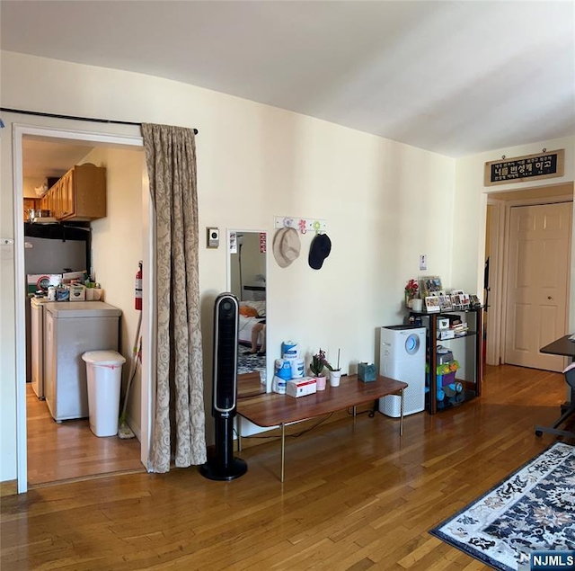 715 Broad Ave Unit 5A, Ridgefield, NJ 07657 - living area with washing machine and dryer and wood finished floors