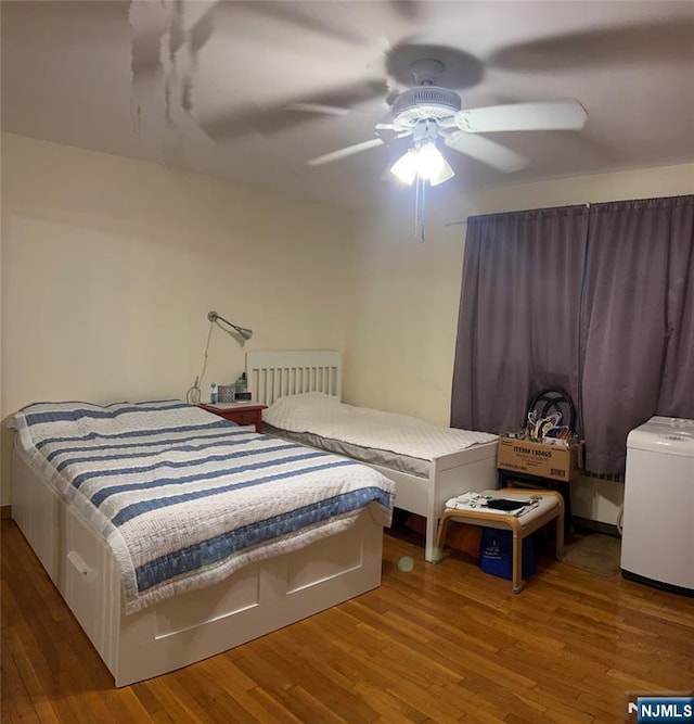 715 Broad Ave Unit 5A, Ridgefield, NJ 07657 - bedroom featuring wood finished floors, ceiling fan, and radiator heating unit