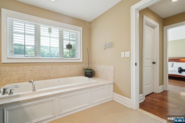 19 Grandview Ave, Glen Rock, NJ 07452 - full bath with a garden tub, tile patterned floors, and baseboards