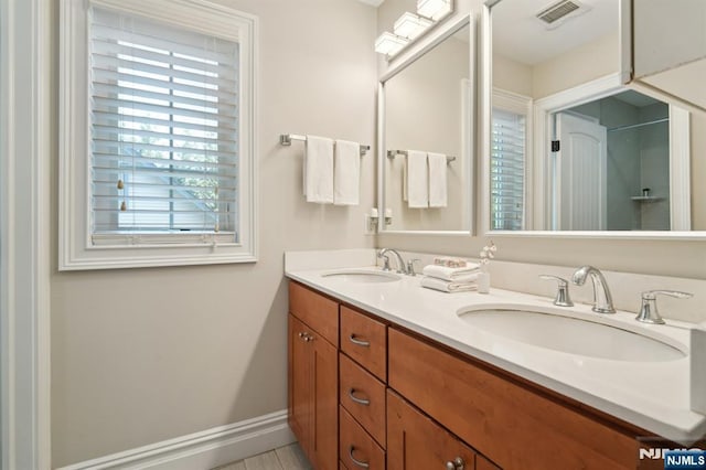 19 Grandview Ave, Glen Rock, NJ 07452 - full bathroom featuring double vanity and baseboards