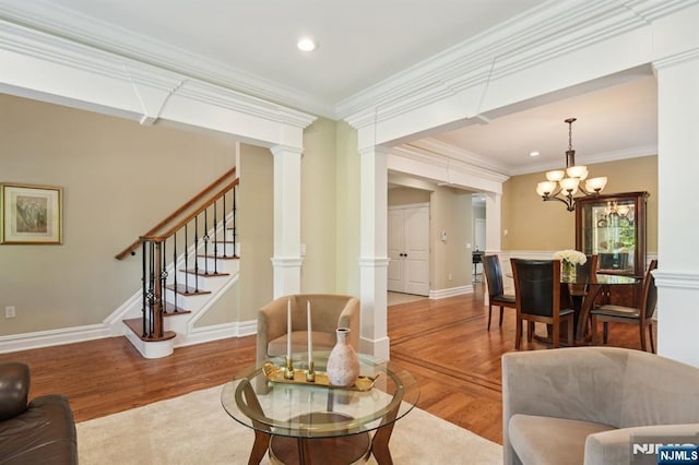 19 Grandview Ave, Glen Rock, NJ 07452 - living area featuring wood finished floors, ornate columns, a chandelier, stairway, and recessed lighting