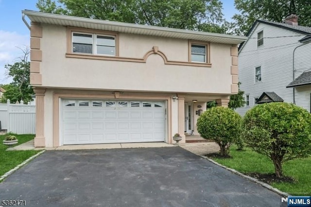 3-11 Lyncrest Ave, Fair Lawn, NJ 07410 - view of front of property featuring driveway, a garage, and stucco siding