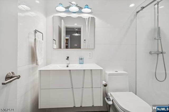 3-11 Lyncrest Ave, Fair Lawn, NJ 07410 - full bathroom featuring tile walls, toilet, vanity, and a shower