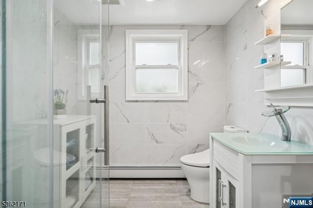 3-11 Lyncrest Ave, Fair Lawn, NJ 07410 - full bathroom with vanity, toilet, a baseboard heating unit, a marble finish shower, and tile walls