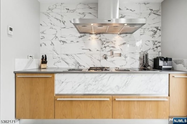3-11 Lyncrest Ave, Fair Lawn, NJ 07410 - bar area featuring island range hood, tasteful backsplash, and stovetop