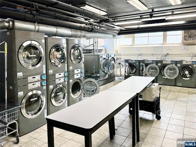 90 Prospect Ave Unit 10G, Hackensack, NJ 07601 - shared laundry room featuring stacked washing machine and dryer, separate washer and dryer, and tile patterned floors