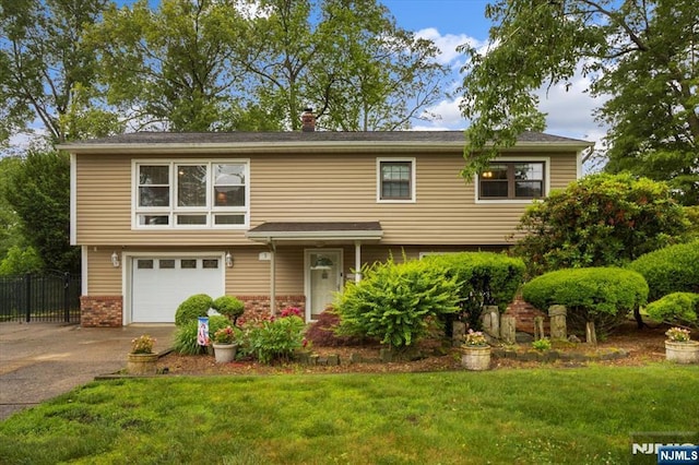 5 Edgewood Ct, Ringwood, NJ 07456 - view of front of house featuring asphalt driveway, brick siding, and an attached garage
