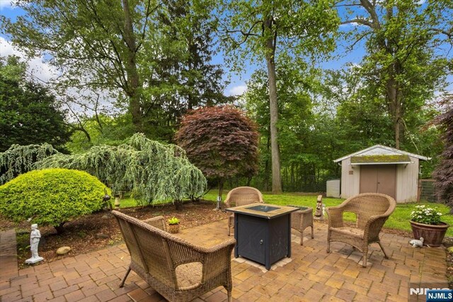 5 Edgewood Ct, Ringwood, NJ 07456 - view of patio / terrace featuring a storage shed and a fire pit