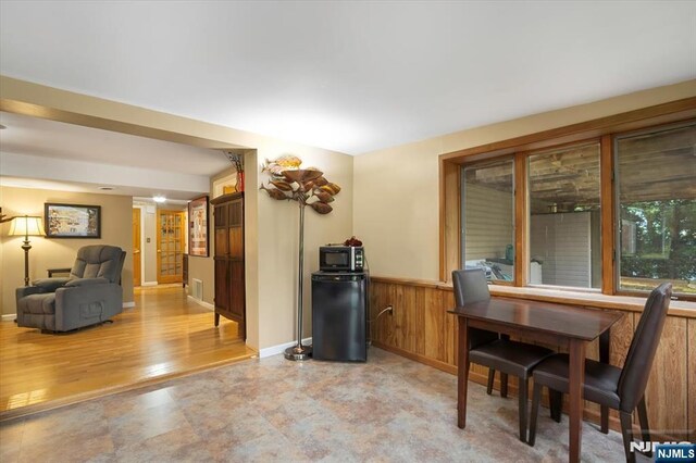5 Edgewood Ct, Ringwood, NJ 07456 - dining room featuring wainscoting and wood walls