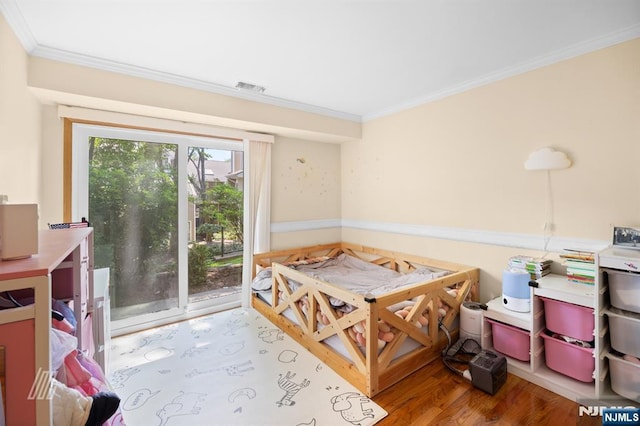 519 Windsor Dr Unit 204, Palisades Park, NJ 07650 - bedroom featuring ornamental molding, wood finished floors, and access to outside