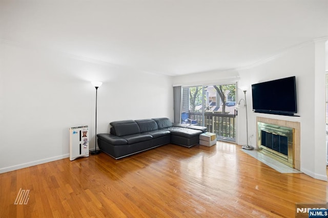 519 Windsor Dr Unit 204, Palisades Park, NJ 07650 - living room with ornamental molding, light wood finished floors, a premium fireplace, and baseboards