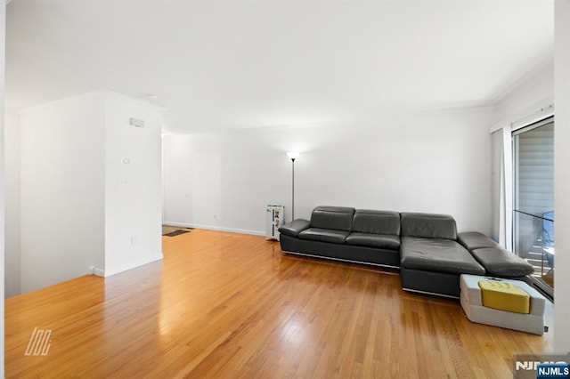 519 Windsor Dr Unit 204, Palisades Park, NJ 07650 - living area with light wood-style floors and ornamental molding