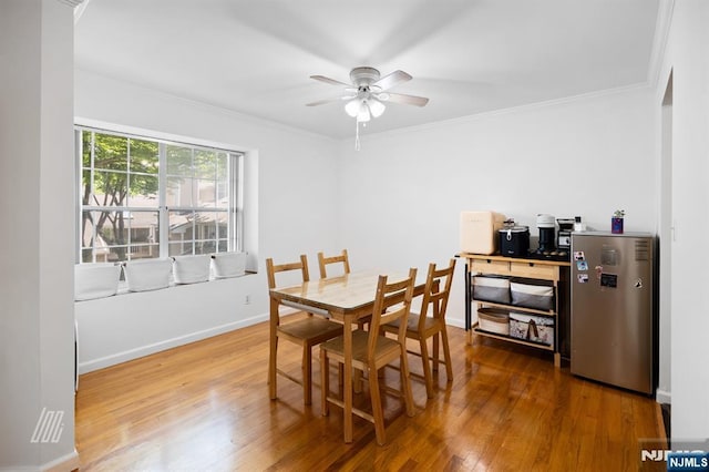 519 Windsor Dr Unit 204, Palisades Park, NJ 07650 - dining space featuring wood finished floors, a ceiling fan, ornamental molding, and baseboards