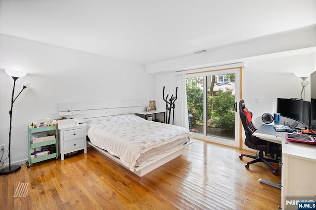 519 Windsor Dr Unit 204, Palisades Park, NJ 07650 - bedroom with access to outside, an office area, and light wood-type flooring