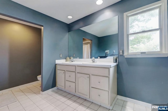 14 Swan Ct, East Rutherford, NJ 07073 - bathroom featuring double vanity and tile patterned floors