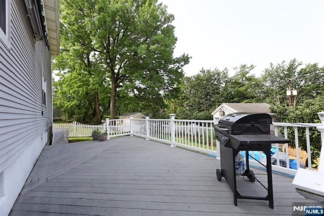 14 Swan Ct, East Rutherford, NJ 07073 - wooden terrace featuring grilling area and view of scattered trees