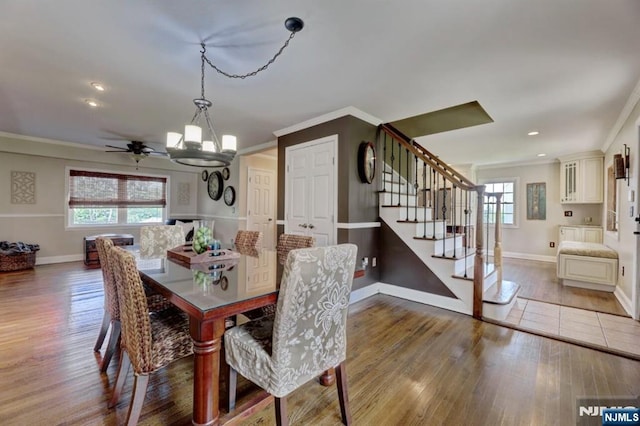 14 Swan Ct, East Rutherford, NJ 07073 - dining room featuring ornamental molding, stairs, a chandelier, wood finished floors, and recessed lighting