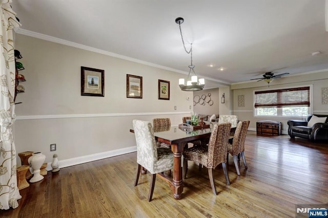 14 Swan Ct, East Rutherford, NJ 07073 - dining space with wood finished floors, ornamental molding, a chandelier, and a ceiling fan