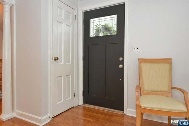 408 Eton Ct, Ridgewood, NJ 07450 - entryway with light wood-type flooring and ornate columns
