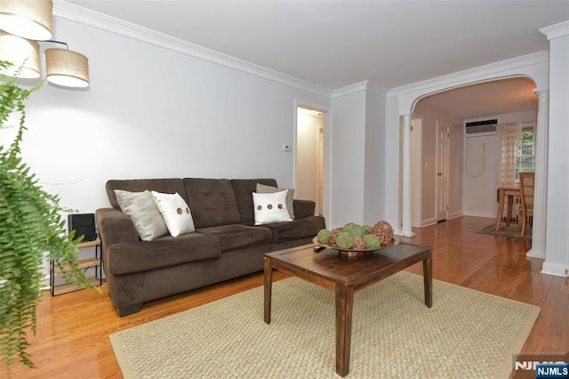 408 Eton Ct, Ridgewood, NJ 07450 - living area with ornate columns, arched walkways, light wood-type flooring, crown molding, and an AC wall unit