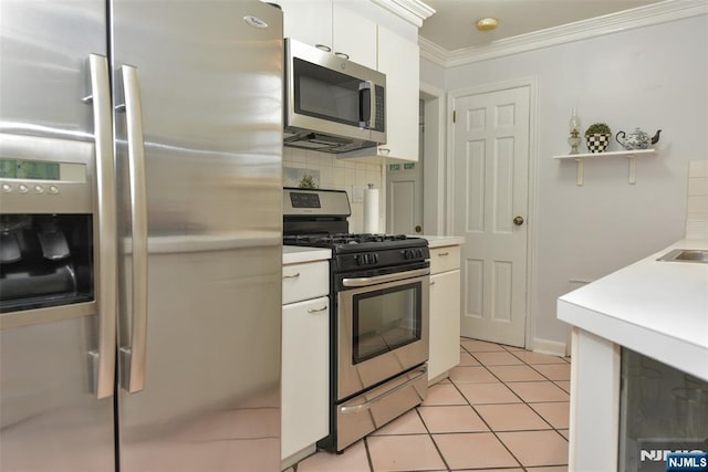 408 Eton Ct, Ridgewood, NJ 07450 - kitchen featuring appliances with stainless steel finishes, light countertops, decorative backsplash, white cabinetry, and ornamental molding