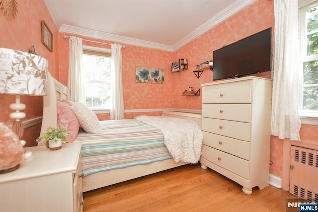 408 Eton Ct, Ridgewood, NJ 07450 - bedroom with radiator heating unit, wallpapered walls, light wood-style floors, multiple windows, and crown molding
