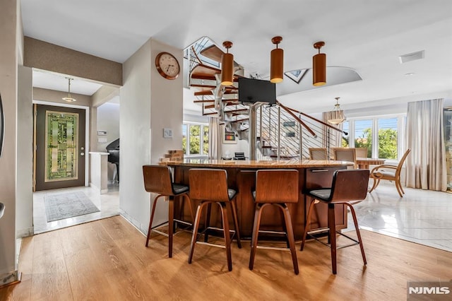 28 Elizabeth Ct, Secaucus, NJ 07094 - indoor bar with pendant lighting, light wood finished floors, and stairway
