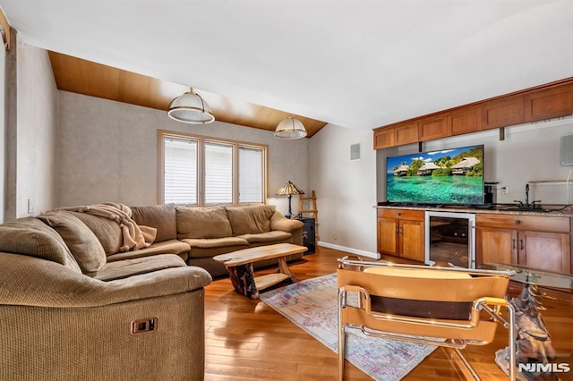 28 Elizabeth Ct, Secaucus, NJ 07094 - living room featuring beverage cooler, light wood finished floors, bar, and baseboards