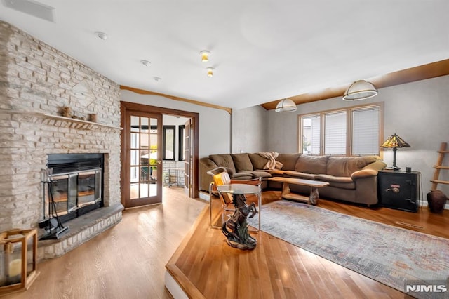 28 Elizabeth Ct, Secaucus, NJ 07094 - living area with wood finished floors and a fireplace
