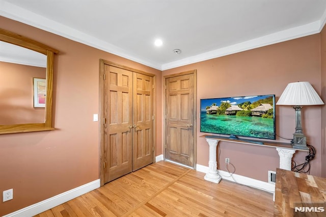 28 Elizabeth Ct, Secaucus, NJ 07094 - foyer entrance featuring wood finished floors, baseboards, and crown molding